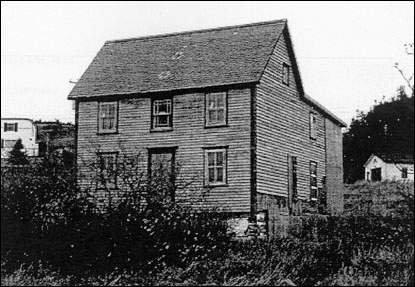 House Featuring a Steep Gable Roof