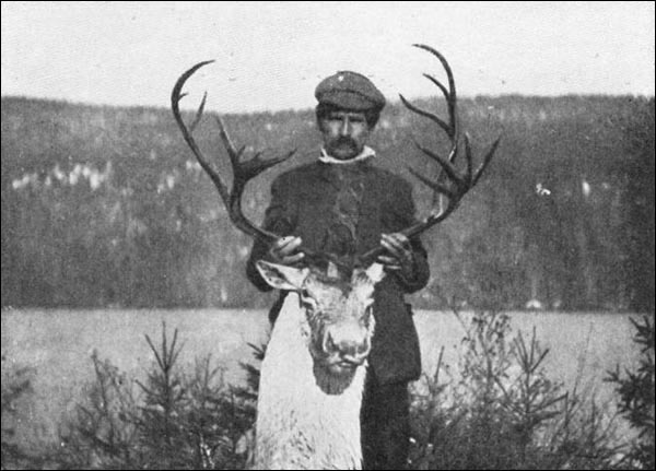 Unidentified Man Holding Caribou Head, pre-1909
