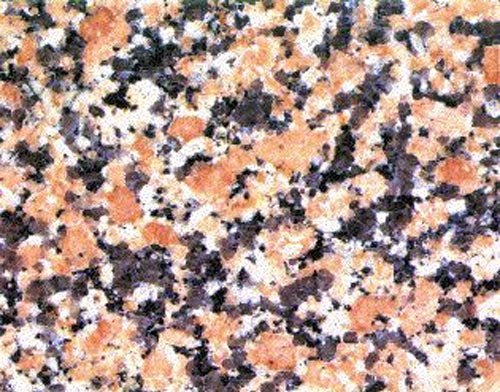 Échantillon de granite , isogranulaire, rose-rougeâtre à grains moyens, de Seal Cove